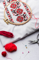 Embroidery with colored threads and various sewing accessories