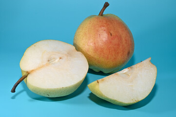two juicy pears on a green background, studio shooting 8