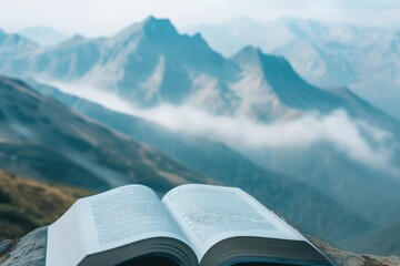 Open book page showcasing a mountain range, with small, misty clouds floating up from the peaks - obrazy, fototapety, plakaty