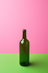 layout. green glass bottle on pink background. mockup