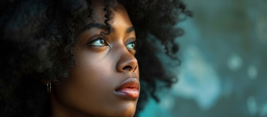 Fototapeta premium Pretty Black Woman Looking Thoughtful: A Captivating Portrait of a Pretty Black Woman Gazing Intensely and Reflecting on Life.
