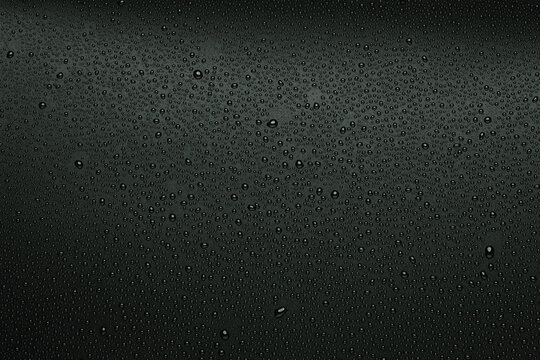 Water droplets on black background