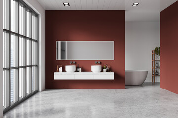 Red hotel bathroom interior with double sink and bathtub, panoramic window