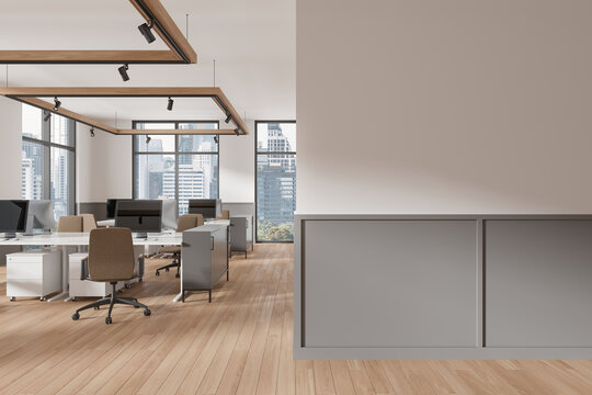 Office coworking interior with pc desktop and chairs in row, window. Mockup wall