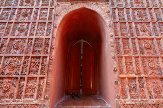 View of the beautiful terracotta facade wall and entrance of ancient Atiya or Atia mosque, Tangail, Bangladesh