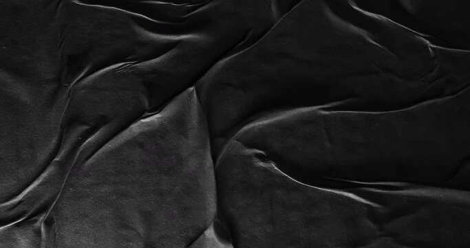 Black paper poster texture background with abstract moving light