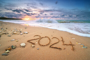 2024 year on the sea shore during sunset