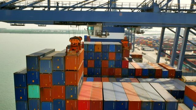 Lazaro Cardenas, Mexico - 18.03.2023 Container ship has loading operations with few gantry cranes in Lazaro Cardenas Container Terminal during the the day time.