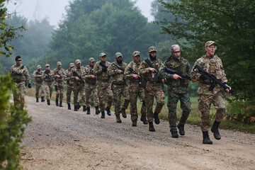 An elite military unit, led by a major, confidently parades through dense forest, showcasing precision, discipline, and readiness for high-risk operations