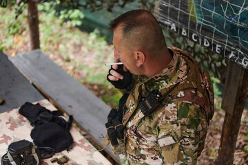 The esteemed leader of an elite military unit, strategic brilliance unfolds as he meticulously...