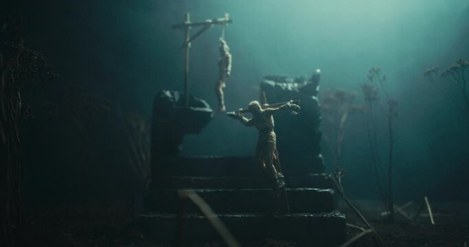 A miniature of two bodies hanging on the gallows at the altar of evil