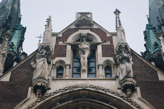 Vintage sculptural composition Crucifix with the upcoming on the facade of the church of Olga and Elizabeth in Lviv, Ukraine. Gothic architecture.