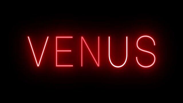 Flickering red retro style neon sign glowing against a black background for VENUS