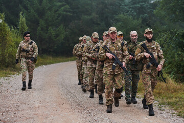 An elite military unit, led by a major, confidently parades through dense forest, showcasing...