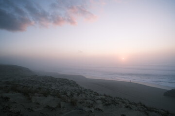 The Atlantic Ocean coast at dusk in winter during a foggy day. Cap Ferret, France - January 25,...
