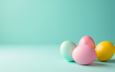 Colorful Easter eggs on pastel green background