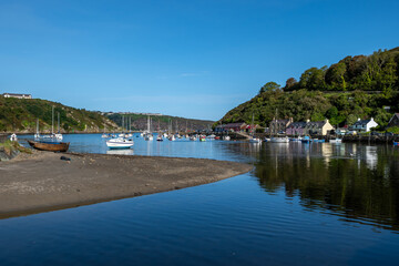 Fototapeta na wymiar Old Harbor With Boats In The Village Fishguard At The Atlantic Coast Of Pembrokeshire In Wales, United Kingdom