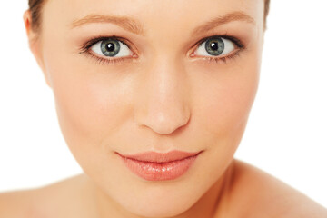 Fototapeta premium Skincare, beauty and portrait of woman on a white background for wellness, cosmetics and facial. Dermatology, salon and isolated face of person with makeup, healthy skin and aesthetic in studio