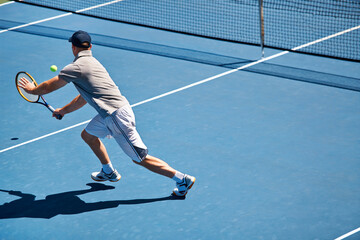 Sport, man and tennis on court with fitness, competition and performance outdoor with match and...