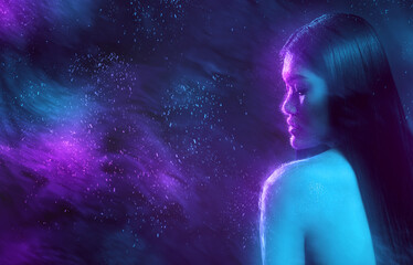 Silhouette of woman in blue and purple sparks in dark