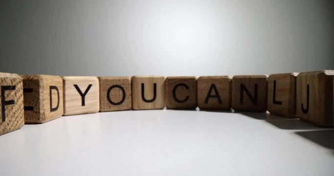 Wooden cubes with letters of English alphabet. Dyslexia in children and adults