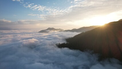Flight above the clouds in the mountains of Georgia