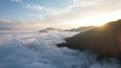 Flight above the clouds in the mountains of Georgia