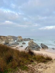 Rocky ocean coast, mist and fog at the ocean bay, rocks at the ocean coast, impressive