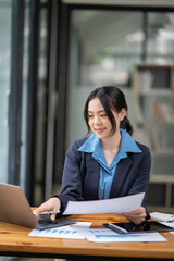 Businesswoman talking to customers online together at the office.