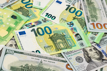 Fototapeta na wymiar Hundred dollars and euros bills. Finance concept background