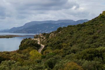 Fototapeta na wymiar road between mountains and sea in albania in November, landscape with lake, lake in the mountains