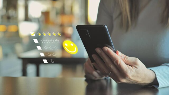 Satisfied customer sitting at the coffee shop gives positive rating feedback on smartphone application,female sits at the bar giving five stars review smart phone app,graphic animation