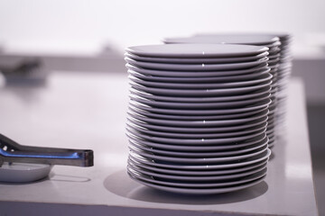 Many white dishes were placed on the table. In a coffee shop or restaurant