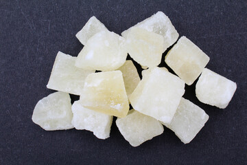 Indian sweet petha or Agra petha on black background close-up view 
