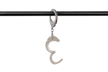 opened handcuffs fastened to a pipe, liberation concept, cut out, isolated on a white background.