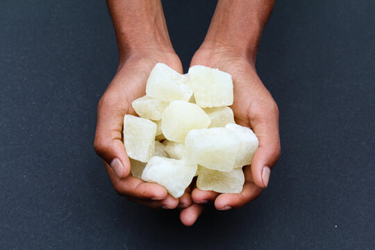 Holding some sweet Agra petha in hand 