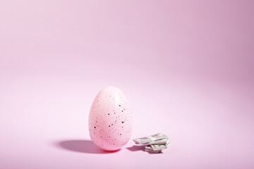 Easter loan, mortgage, spring payments, Easter egg and a pack of cash, discounts and banking...