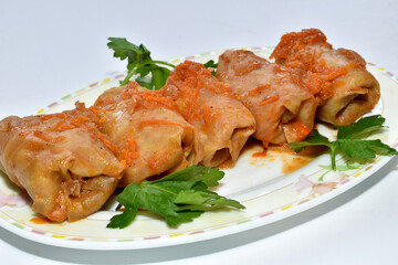 Stuffed cabbage rolls, ready to eat on a plate.