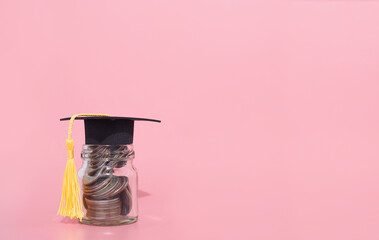 Glass bottle with graduation hat. The concept of saving money for education, student loan,...