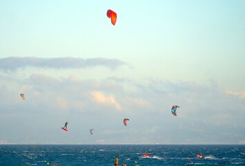 view over the Atlantic Ocean with many kitesurfers with Morocco on the horizon, Strait of Gibraltar, Andalusia, Spain