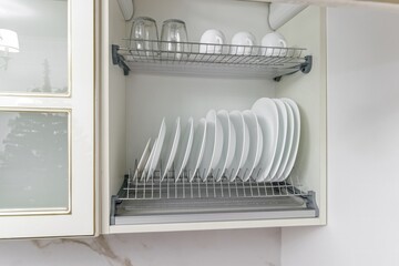 pure white cup with plate , standing in white cupboard
