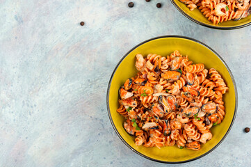Pasta with mussels and shrimp.