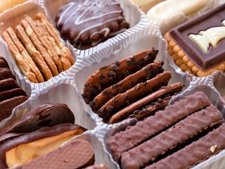 Different kinds of cookies in a plastic box