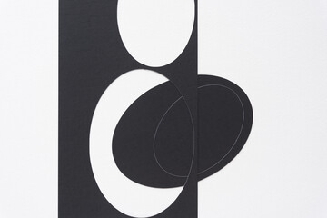 machine-cut stencil with oval cutouts and oval shapes on blank paper