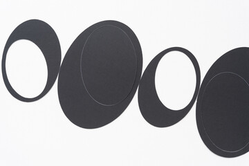 set of machine-cut ovals on blank paper