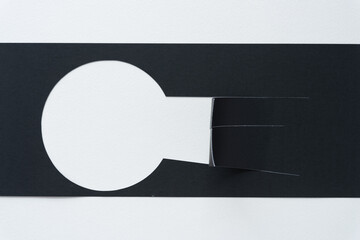 abstract machine-cut black paper with keyhole form and cut flaps