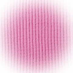 Light pink background from a textile material with wicker pattern, closeup. Cloth backdrop with vignette.