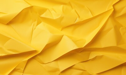 Yellow crumpled paper with space for text on yellow background.