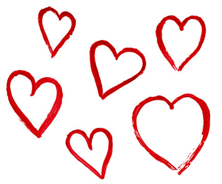 outlines of hearts drawn with watercolor red paint on a white isolated background