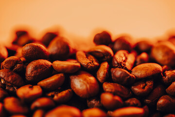  Roasted coffee beans with smoke and fire background. Close up,